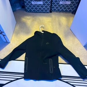 This is a Nike tech with a light stain not bad